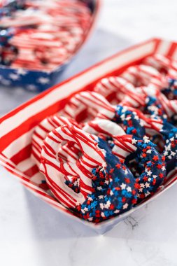 American flag. Red, white, and blue chocolate-covered pretzel twists.