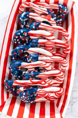 American flag. Red, white, and blue chocolate-covered pretzel twists.