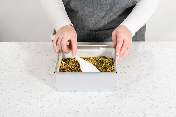 Filling Square Cheesecake Pan Lined Parchment Paper Fudge Mixture Prepare — Stock fotografie