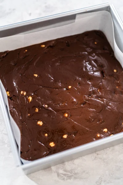 Filling Square Cheesecake Pan Lined Parchment Paper Fudge Mixture Prepare — Zdjęcie stockowe