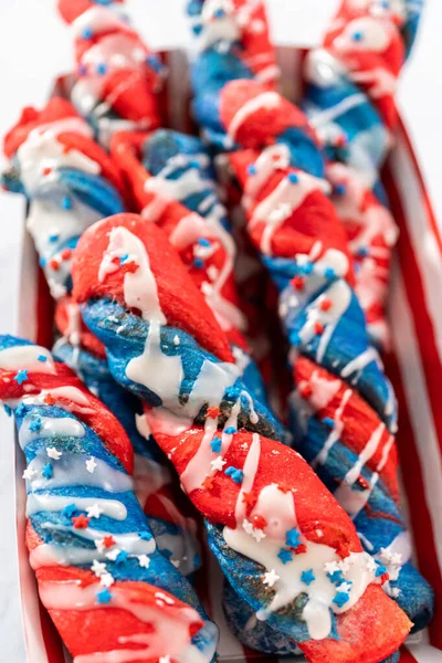 Patriotic Cinnamon Twists Drizzled White Glaze Decorated Star Sprinkles — Stock Photo, Image