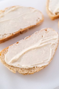 Prepare provolone and apple grilled cheese sandwich.