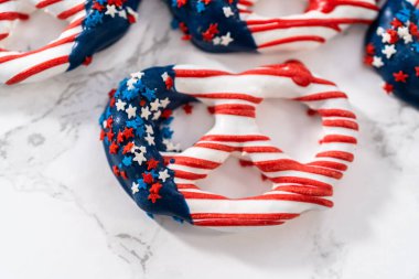 American flag. Red, white, and blue chocolate-covered pretzel twists.