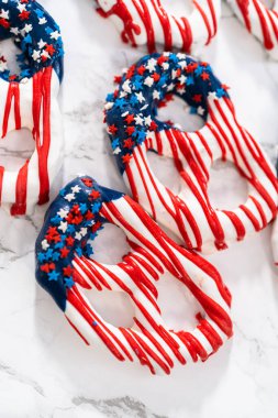 American flag. Red, white, and blue chocolate-covered pretzel twists.