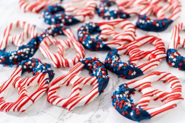 American flag. Red, white, and blue chocolate-covered pretzel twists.