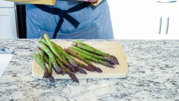 Large Organic Asparagus Stalks Being Sliced Modern White Kitchen Preparation — Stock Photo, Image