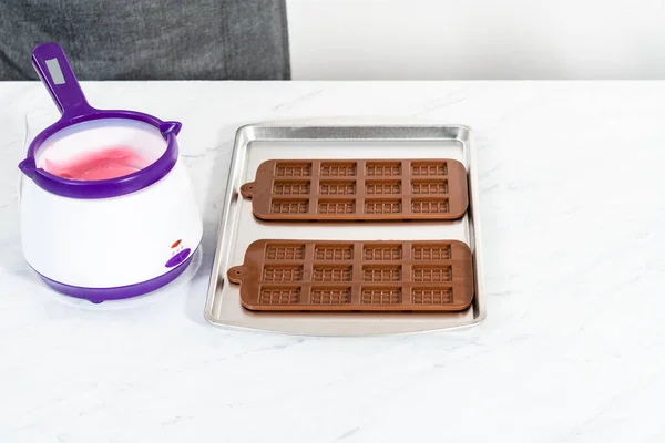 Filling Silicone Chocolate Mold Melted Chocolate Make Mini Pink Chocolates — Stock Photo, Image