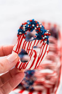 American flag. Red, white, and blue chocolate-covered pretzel twists.