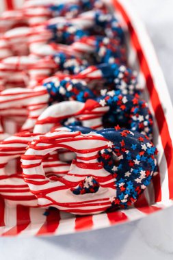 American flag. Red, white, and blue chocolate-covered pretzel twists.