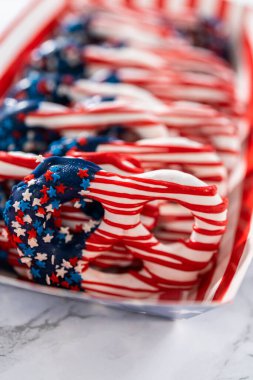 American flag. Red, white, and blue chocolate-covered pretzel twists.