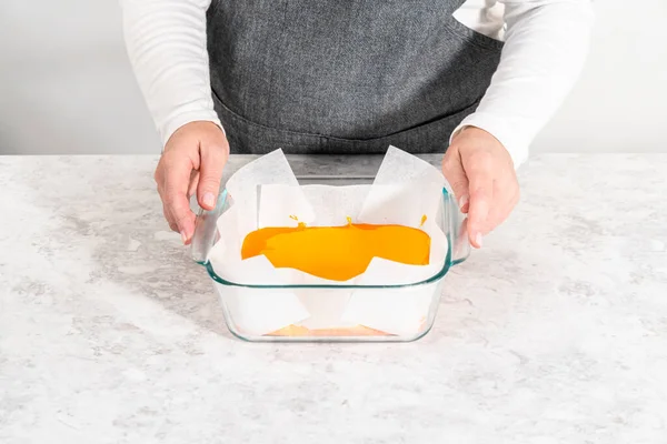 Pouring Fudge Mixture Square Glass Baking Pan Lined Parchment Paper — Stock Photo, Image