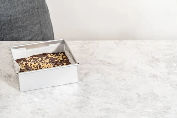 Filling Square Cheesecake Pan Lined Parchment Paper Fudge Mixture Prepare — Stok Foto