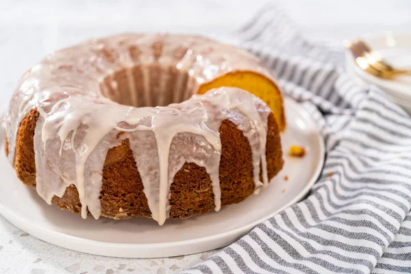 Sliced Vanilla Bundt Cake White Glaze White Plate — Stock Photo, Image