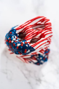 American flag. Red, white, and blue chocolate-covered pretzel twists.