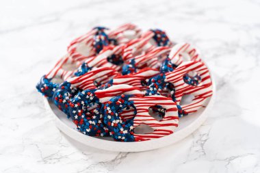 American flag. Red, white, and blue chocolate-covered pretzel twists.