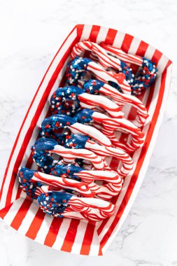 American flag. Red, white, and blue chocolate-covered pretzel twists.
