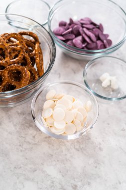 Measured ingredients in glass mixing bowls to make mermaid pretzel twists.
