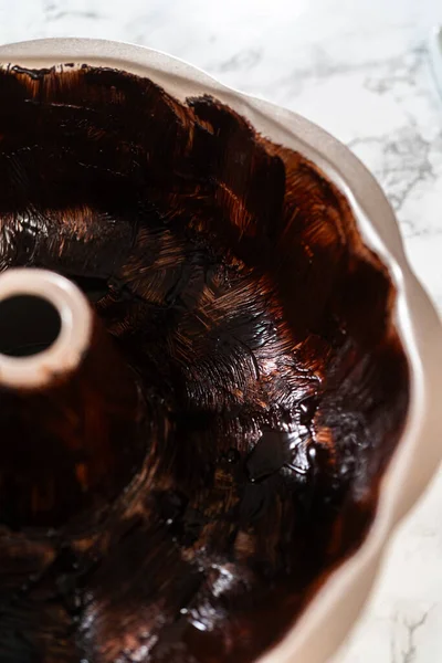 Preparing Bundt Cake Pan Baking Mixture Melted Vegetable Shortening Cocoa — Stock Photo, Image