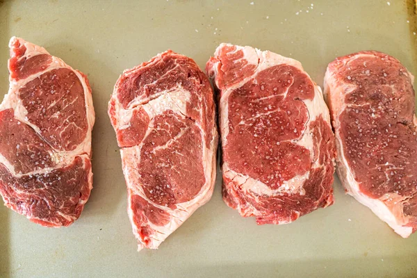 Situated Modern White Kitchen Seasoned Rib Eye Steak Boasting Its — Stock Photo, Image