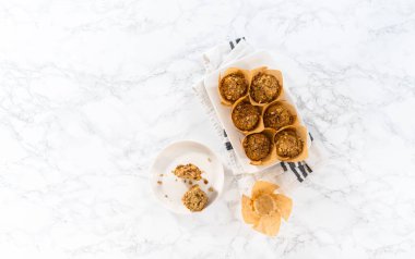 Flat lay. Freshly baked banana oatmeal muffins with oatmeal sugar topping.