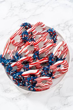 American flag. Red, white, and blue chocolate-covered pretzel twists.