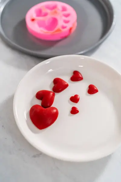 Removing Chocolate Hearts Silicone Mold Decorate Green Fudge — Stock Photo, Image