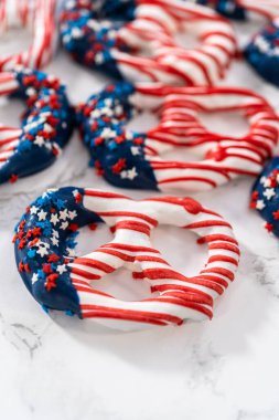 American flag. Red, white, and blue chocolate-covered pretzel twists.