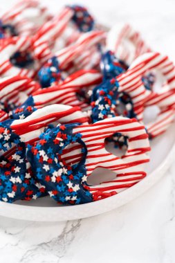 American flag. Red, white, and blue chocolate-covered pretzel twists.
