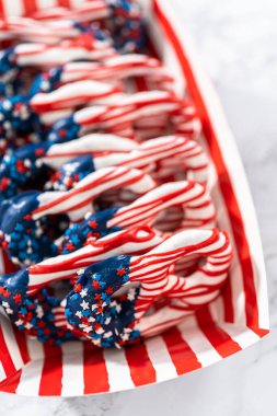 American flag. Red, white, and blue chocolate-covered pretzel twists.