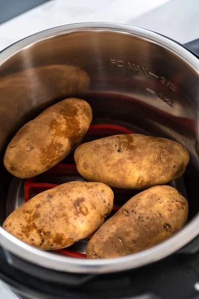 Pressure Cooker Baked Potatoes. Cooking whole potatoes in a pressure cooker to make baked potatoes.