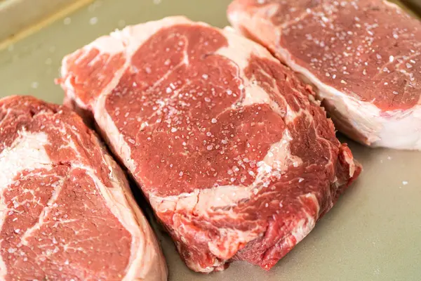 Situated Modern White Kitchen Seasoned Rib Eye Steak Boasting Its — Stock Photo, Image
