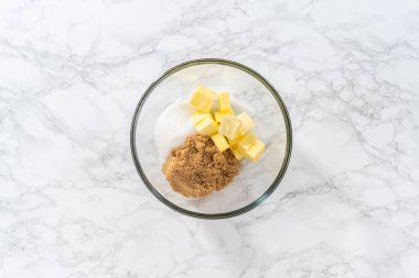 Flat lay. Mixing ingredients with a hand mixer to bake chocolate cookies with chocolate hearts for Valentines Day.