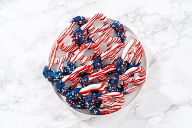 American flag. Red, white, and blue chocolate-covered pretzel twists.