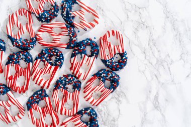 American flag. Red, white, and blue chocolate-covered pretzel twists.