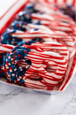 American flag. Red, white, and blue chocolate-covered pretzel twists.
