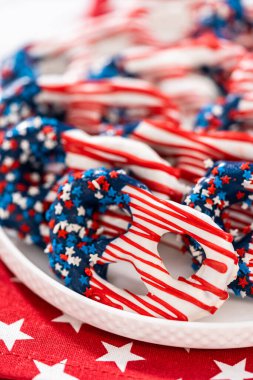 American flag. Red, white, and blue chocolate-covered pretzel twists.