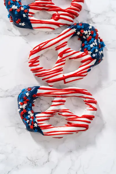 American flag. Red, white, and blue chocolate-covered pretzel twists.