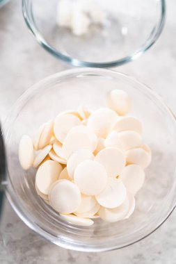 Measured ingredients in glass mixing bowls to make mermaid pretzel twists.