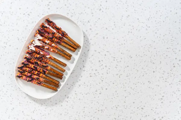 Flat Lay Halloween Chocolate Covered Pretzel Rods Sprinkles White Serving — Stock Photo, Image