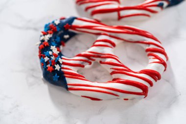 American flag. Red, white, and blue chocolate-covered pretzel twists.