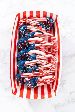 American flag. Red, white, and blue chocolate-covered pretzel twists.