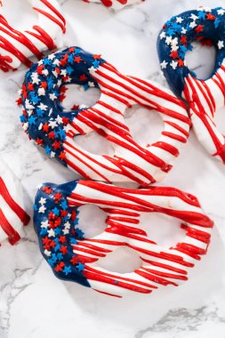 American flag. Red, white, and blue chocolate-covered pretzel twists.