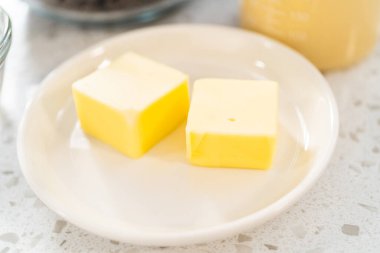 Measured ingredients in glass mixing bowls to make chocolate pistachio fudge.