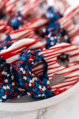 American flag. Red, white, and blue chocolate-covered pretzel twists.