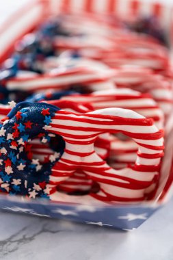 American flag. Red, white, and blue chocolate-covered pretzel twists.