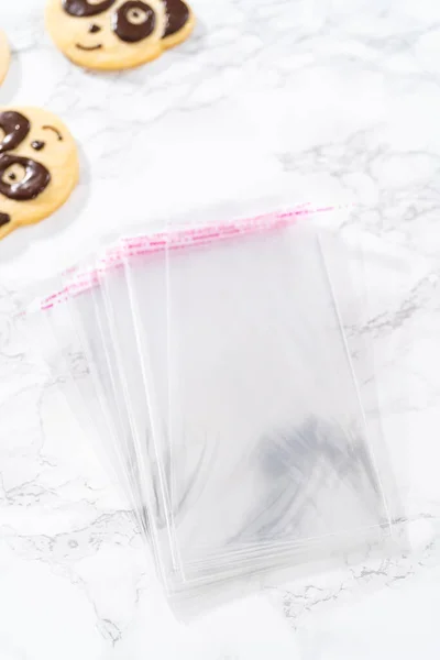 Packaging Panda Shaped Shortbread Cookies Chocolate Icing Individual Clear Bags — Stock Photo, Image