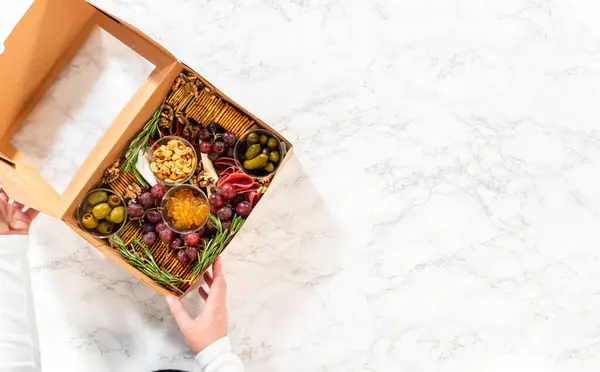Flat Lay Charcuterie Box Featuring Sliced Meat Cheese Crackers Grapes — Stock Photo, Image