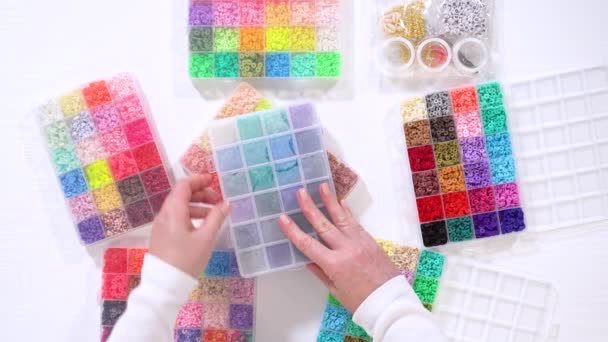 Hands Carefully Arrange Selection Clay Beads Each Compartment Revealing Rainbow — Stock Video