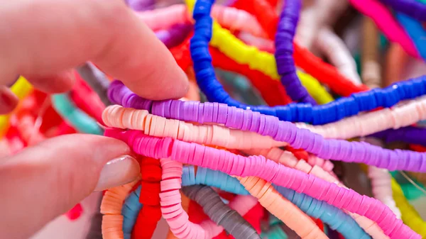 Hands Meticulously Organize Kaleidoscope Multicolored Patterned Clay Beads Intricately Coiled — Stock Photo, Image