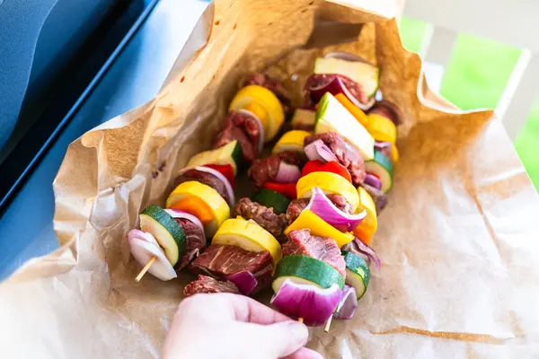 Raw Skewers Beef Fresh Veggies Wrapped Butcher Brown Paper Await — Stock Photo, Image
